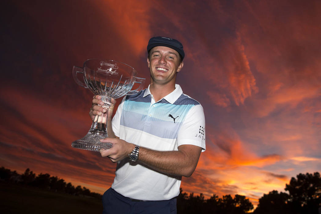 American golfer Bryson DeChambeau poses with the trophy after winning the Shriners Hospitals for Children Open at TPC at Summerlin in Las Vegas on Sunday, Nov. 4, 2018. Richard Brian Las Vegas Rev ...