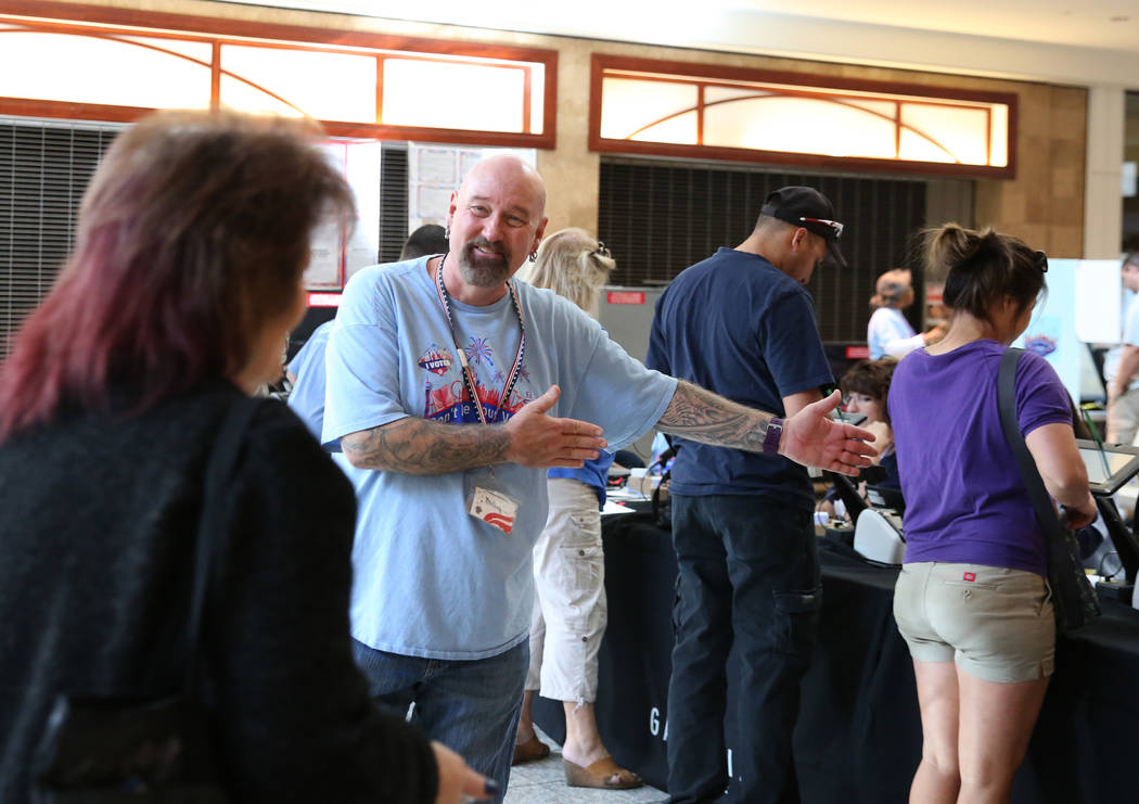Phillip Hollan, an election monitor, directs voters as they arrive to check in at a polling station at Galleria Mall on Tuesday, Nov. 6, 2018, in Henderson. (Bizuayehu Tesfaye/Las Vegas Review-Jou ...