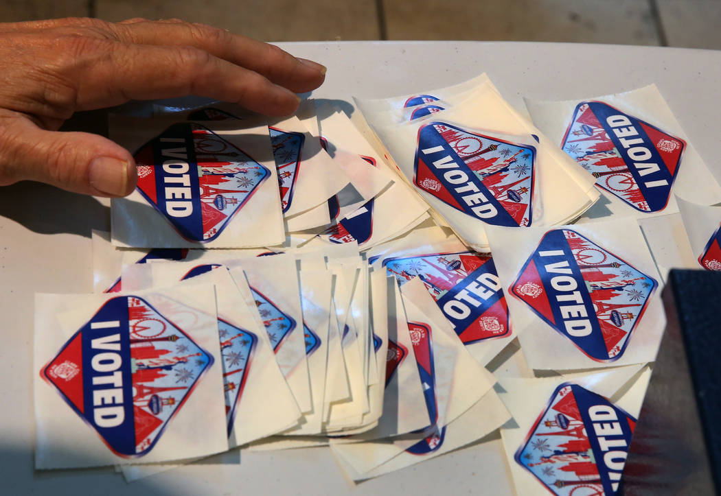 Robert Elvin, an election official, displays "I Voted" stickers at a polling station at Galleria Mall on Tuesday, Nov. 6, 2018, in Henderson. (Bizuayehu Tesfaye/Las Vegas Review-Journal) ...