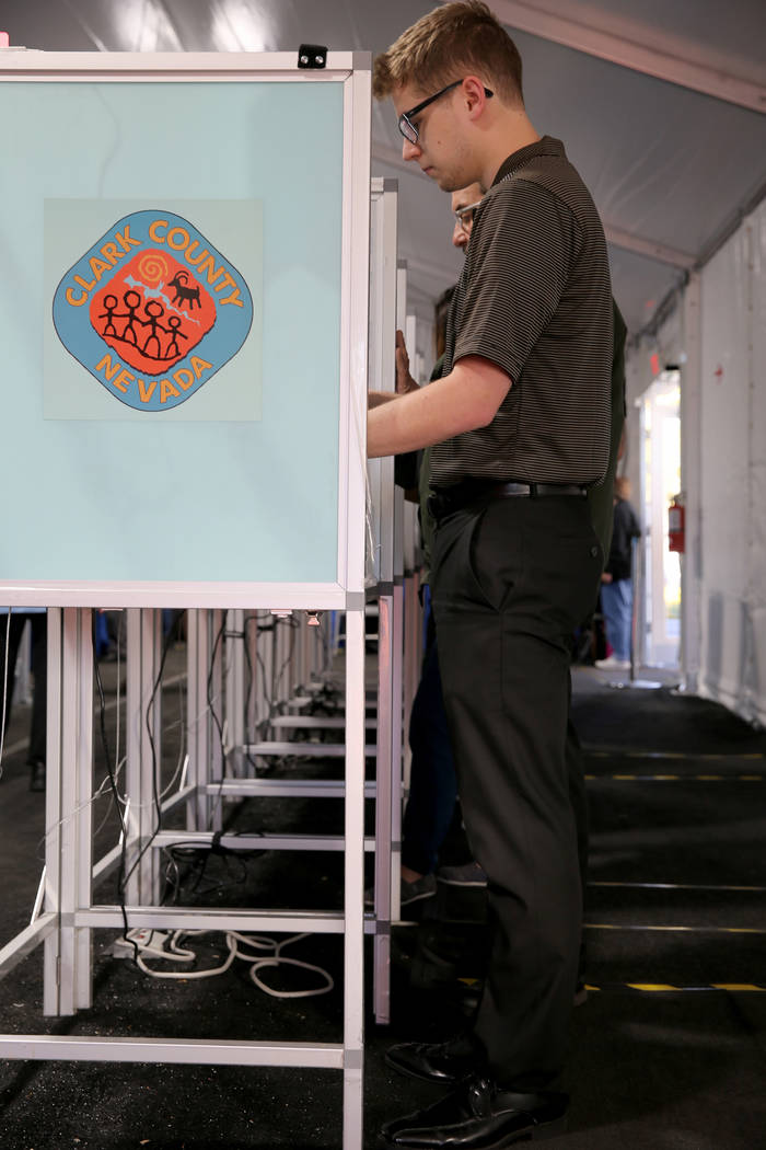 First time voter Holden Oullette, 22, of Las Vegas votes in the voting center at Downtown Summerlin in Las Vegas Tuesday, Nov. 6, 2018. K.M. Cannon Las Vegas Review-Journal @KMCannonPhoto