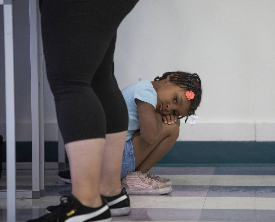 Zariyah Tinsley, 4, waits as her mother casts her ballots at a polling station at Raul Elizondo Elementary School in North Las Vegas, Tuesday, Nov. 6, 2018. Caroline Brehman/Las Vegas Review-Journal