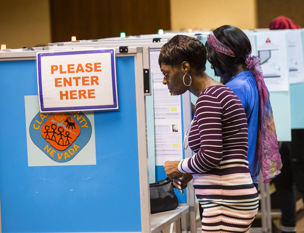 Andrea Saffore looks over her ballot at a polling station at the Regional Transportation Commission building in downtown Las Vegas on Tuesday, Nov. 6, 2018. Chase Stevens Las Vegas Review-Journal ...