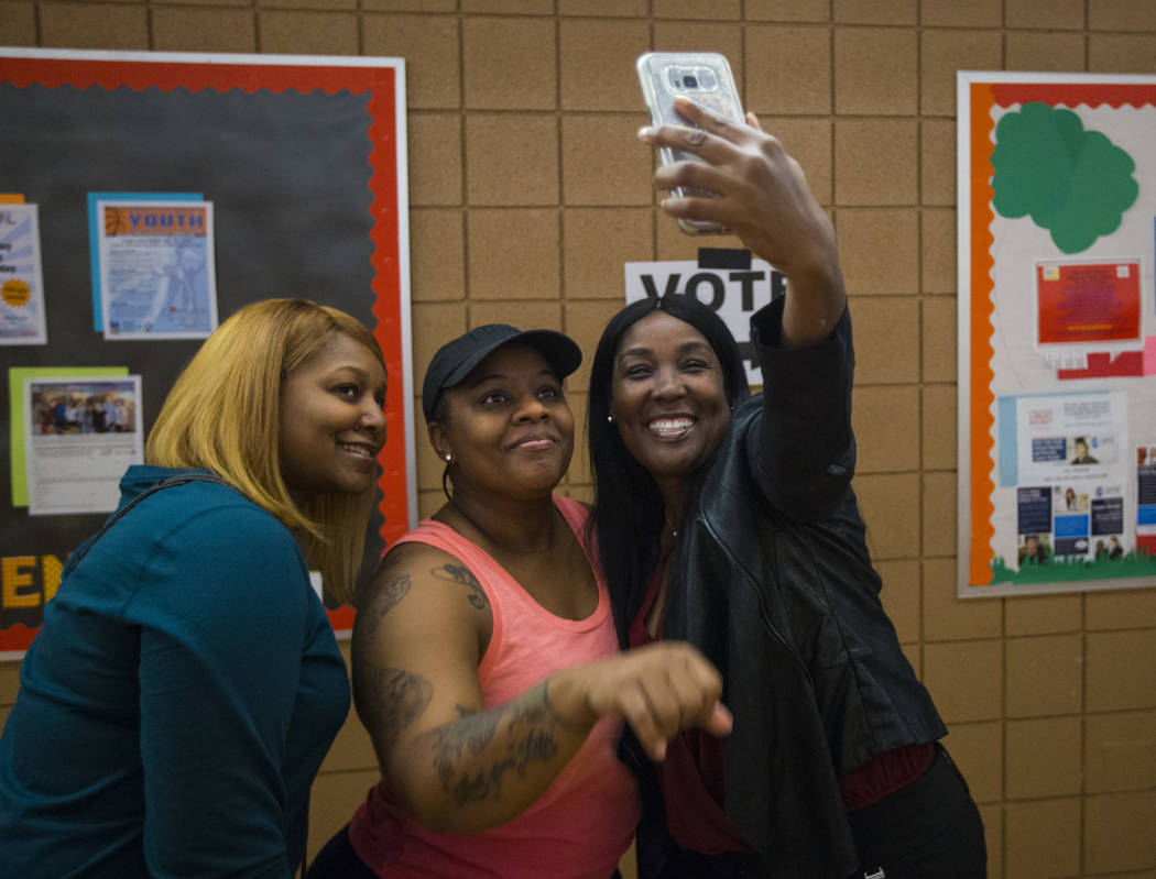 Roshanda Potter, from left, Deandra Jones, and Stephanie Berry pose for a selfie while in line to vote at a polling station at Doolittle Community Center in Las Vegas on Tuesday, Nov. 6, 2018. Cha ...