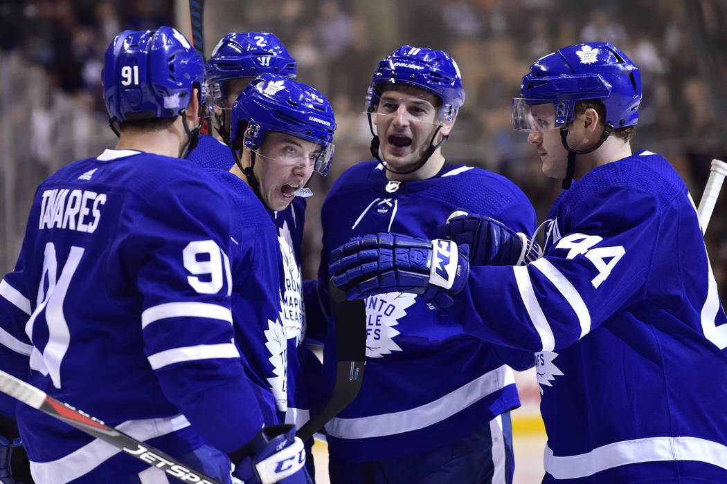 Toronto Maple Leafs right wing Mitchell Marner (16) celebrates his goal against Vegas Golden Knights goaltender Marc-Andre Fleury with teammates during the second period of an NHL hockey game Tues ...