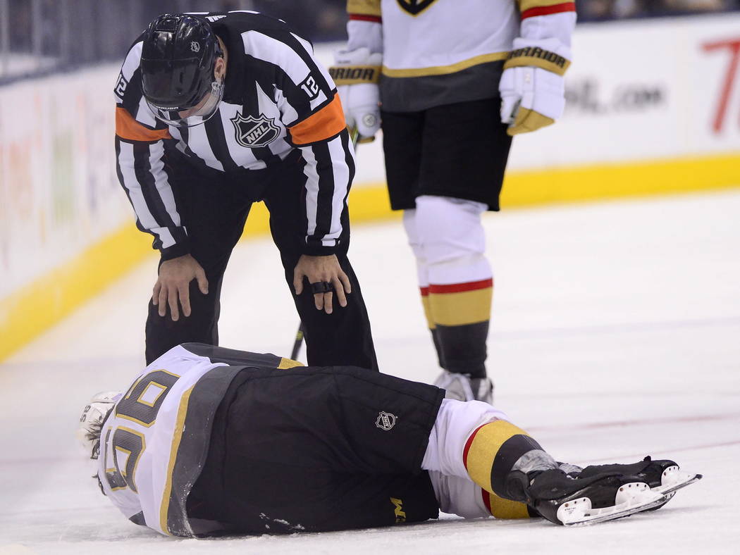 Vegas Golden Knights center Erik Haula (56) lies on the ice after taking a hit along the boards during the third period of an NHL hockey game against the Toronto Maple Leafs on Tuesday, Nov. 6, 20 ...