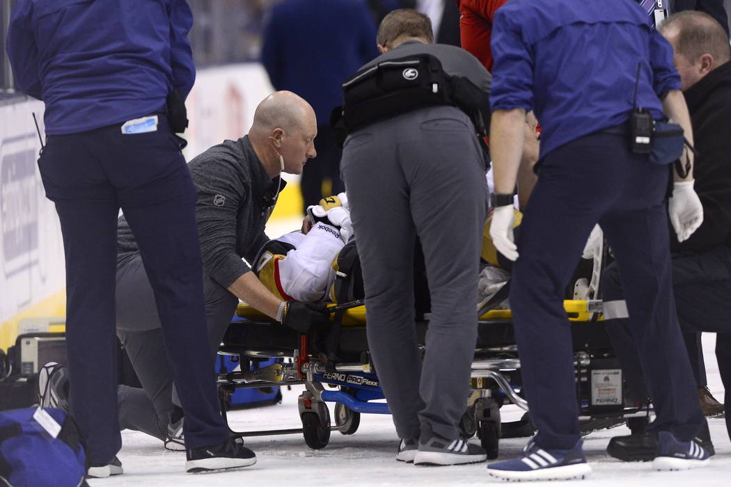 Vegas Golden Knights center Erik Haula (56) is taken off the ice on a stretcher after taking a hit along the boards during the third period of an NHL hockey game against the Toronto Maple Leafs on ...