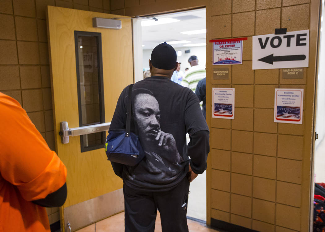 James Givens waits in line to vote at a polling station at Doolittle Community Center in Las Vegas on Tuesday, Nov. 6, 2018. Chase Stevens Las Vegas Review-Journal @csstevensphoto