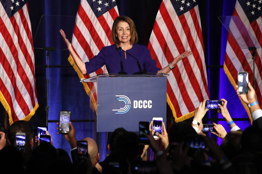 House Minority Leader Nancy Pelosi of Calif., smiles as she is cheered by a crowd of Democratic supporters during an election night returns event at the Hyatt Regency Hotel, on Tuesday, Nov. 6, 20 ...
