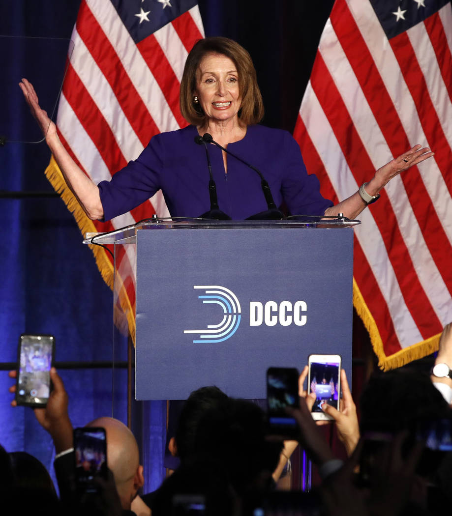 House Minority Leader Nancy Pelosi of Calif., smiles as she is cheered by a crowd of Democratic supporters during an election night returns event at the Hyatt Regency Hotel, on Tuesday, Nov. 6, 20 ...