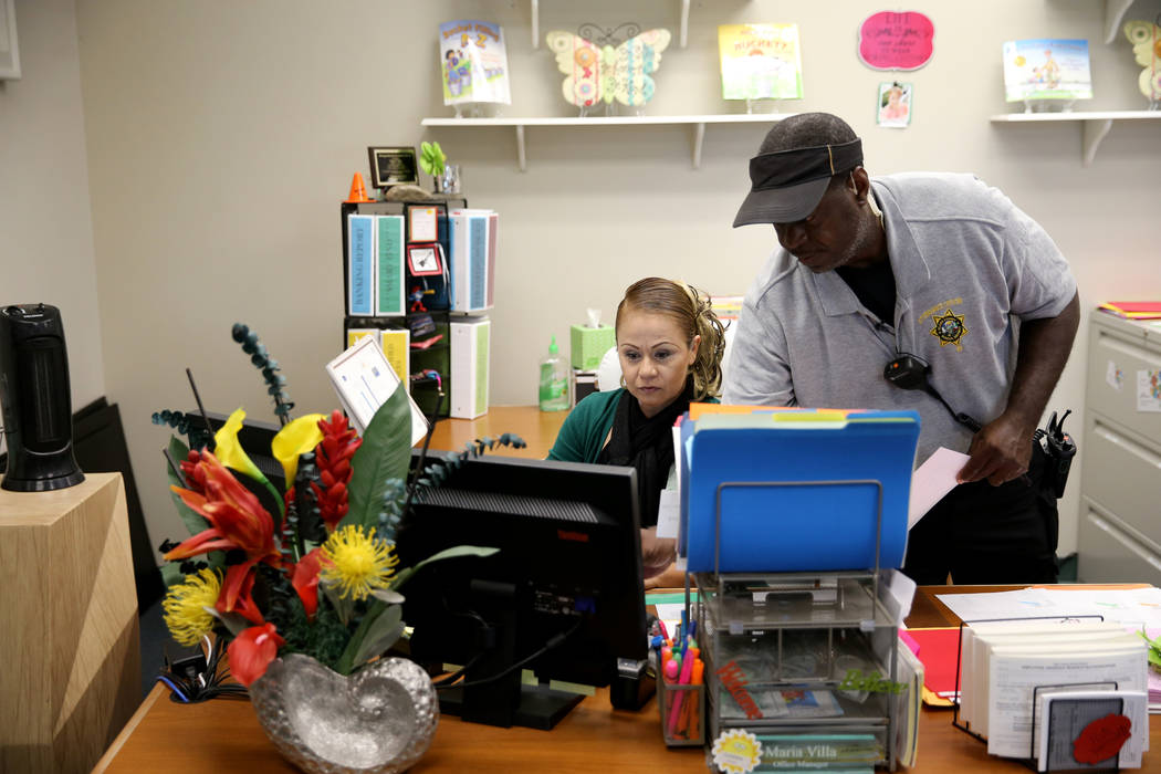 Clark County School District Attendance Officer Tony Stark checks for absent students with Office Manager Maria Villa at Petersen Elementary School in Las Vegas Monday, Oct. 17, 2018. K.M. Cannon ...
