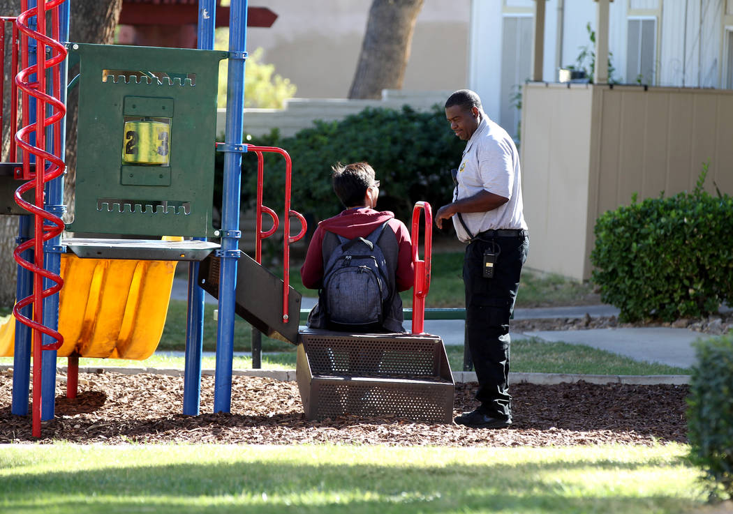 Clark County School District Attendance Enforcement Officer Tony Stark checks on a student at Canyon Club Apartments in Las Vegas Tuesday, Oct. 18, 2018. The student was a senior who was home earl ...