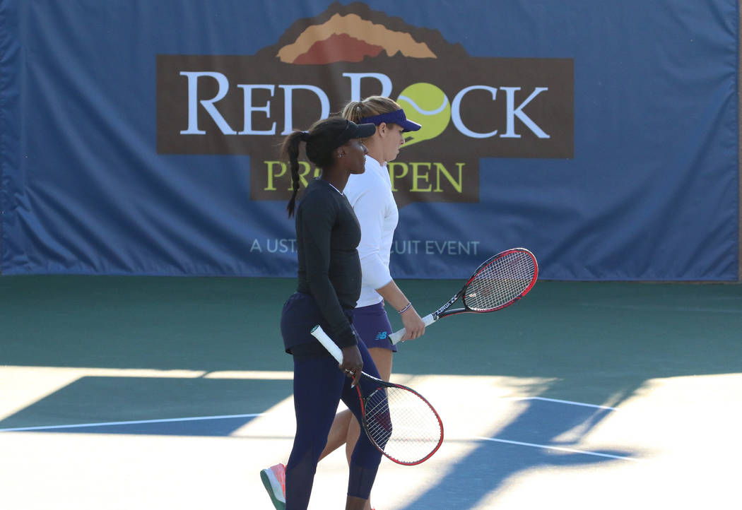 Asia Muhammad, front, and Maria Sanchez leave the court after winning against Manon Arcangioli and Sherazad Reix of France during their doubles match at the Red Rock Pro Open tennis tournament at ...