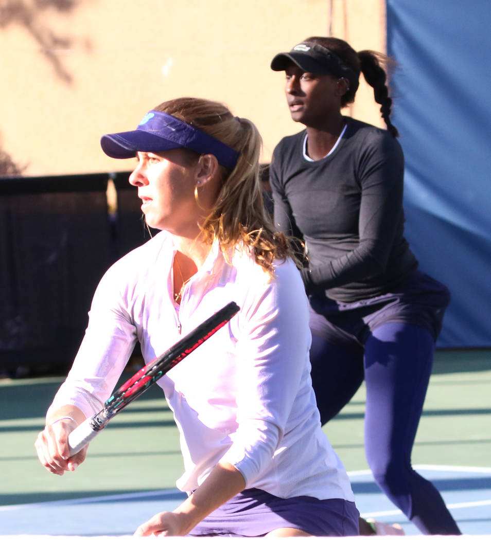 Asia Muhammad, back, and Maria Sanchez keep their eyes on the ball as they face Manon Arcangioli and Sherazad Reix of France during their doubles match at the Red Rock Pro Open tennis tournament a ...