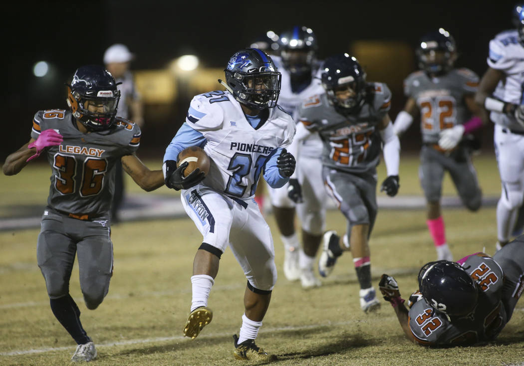 Canyon Springs' Martin Blake (21) runs the ball during the first half of a football game at Legacy High School in North Las Vegas on Thursday, Oct. 25, 2018. Chase Stevens Las Vegas Review-Journal ...