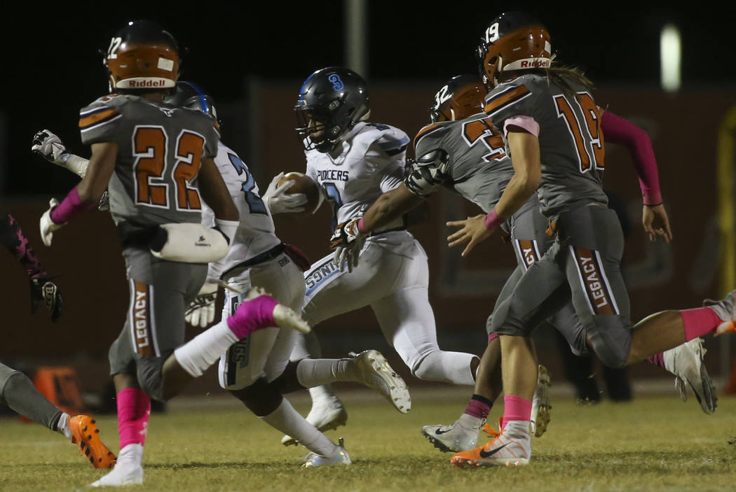 Canyon Springs' Jayvioin Pugh (3) runs the ball during the first half of a football game at Legacy High School in North Las Vegas on Thursday, Oct. 25, 2018. Chase Stevens Las Vegas Review-Journal ...