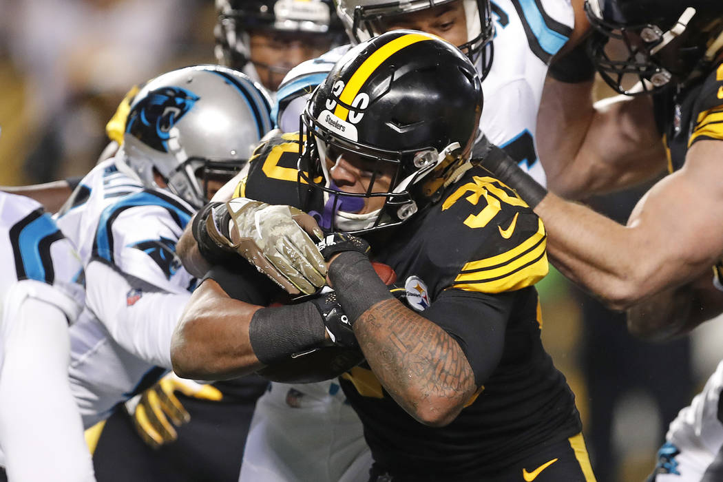 Pittsburgh Steelers running back James Conner (30) rushes for a touchdown during the first half of the team's NFL football game against the Carolina Panthers in Pittsburgh, Thursday, Nov. 8, 2018. ...