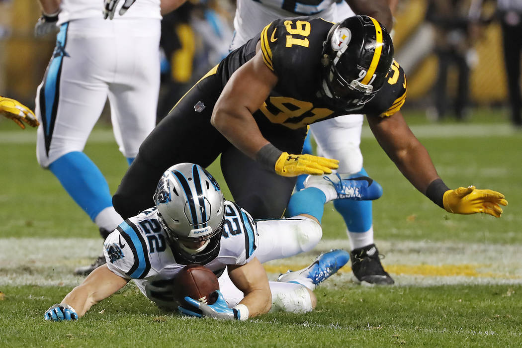 Carolina Panthers running back Christian McCaffrey (22) recovers a fumble by quarterback Cam Newton with Pittsburgh Steelers defensive end Stephon Tuitt (91) defending during the first half of an ...