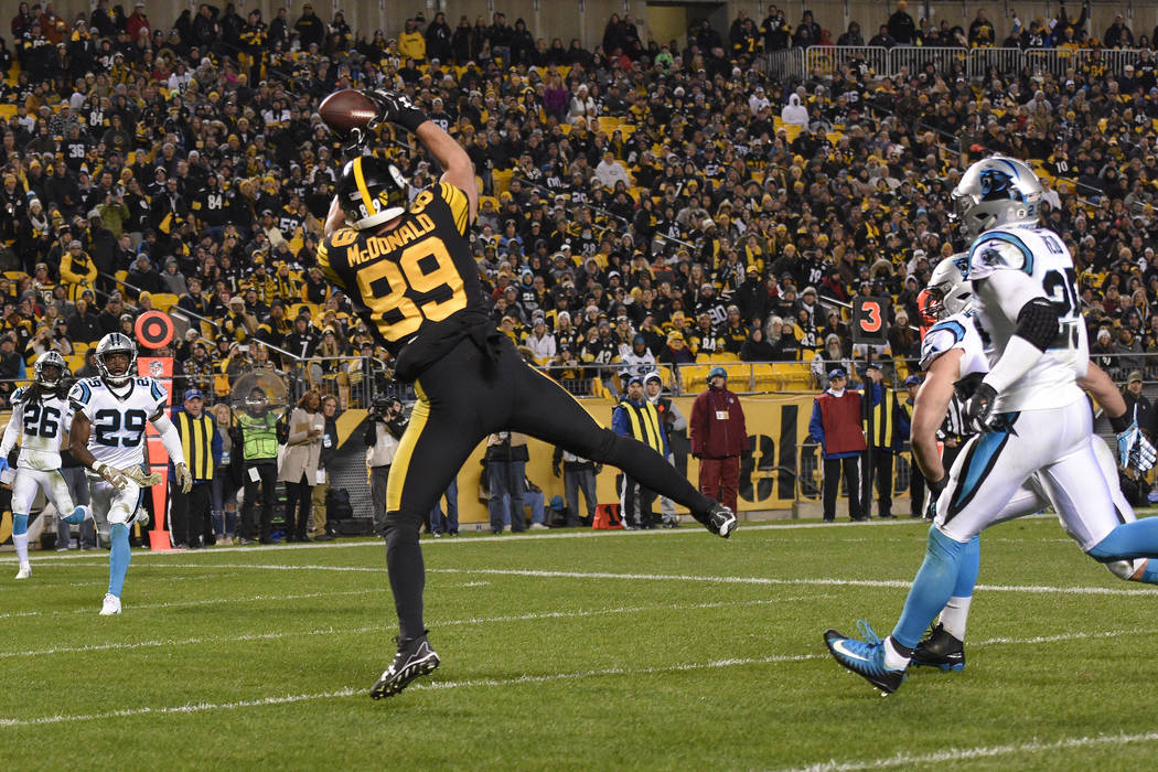 Pittsburgh Steelers tight end Vance McDonald (89) hauls in a pass from quarterback Ben Roethlisberger for a touchdown during the second half of an NFL football game against the Carolina Panthers i ...