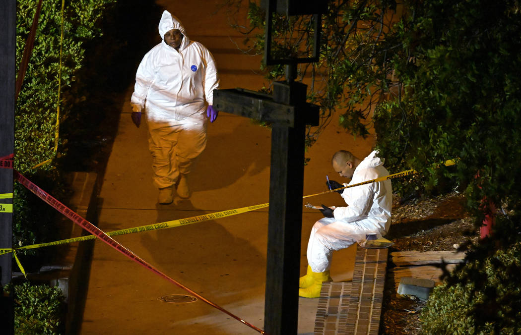 A forensics team works the scene Thursday, Nov. 8, 2018, in Thousand Oaks, Calif.,where a gunman opened fire Wednesday inside a country dance bar crowded with hundreds of people on "college n ...