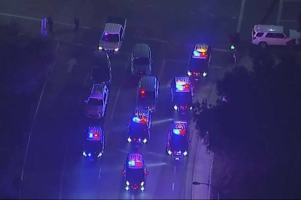 In this image made from aerial video, police vehicles block an intersection in the vicinity of a shooting in Thousand Oaks, California, early Thursday, Nov. 8, 2018. Authorities say there were mu ...
