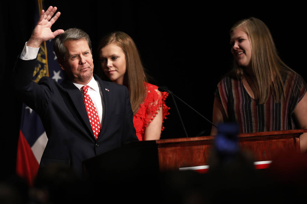 Georgia Republican gubernatorial candidate Brian Kemp acknowledges supporters early Wednesday, Nov. 7, 2018, after a long election night in Athens, Ga. (Joshua L. Jones/Athens Banner-Herald via AP)