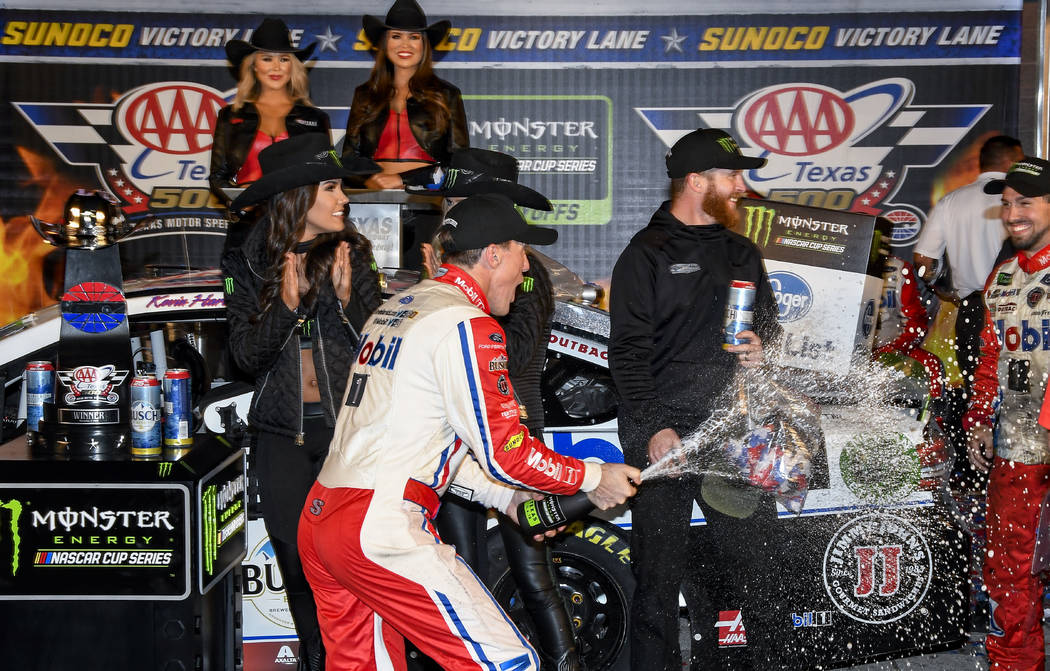 Kevin Harvick celebrates in Victory Lane after winning a NASCAR Cup auto race at Texas Motor Speedway, Sunday, Nov. 4, 2018, in Fort Worth, Texas. (AP Photo/Larry Papke)