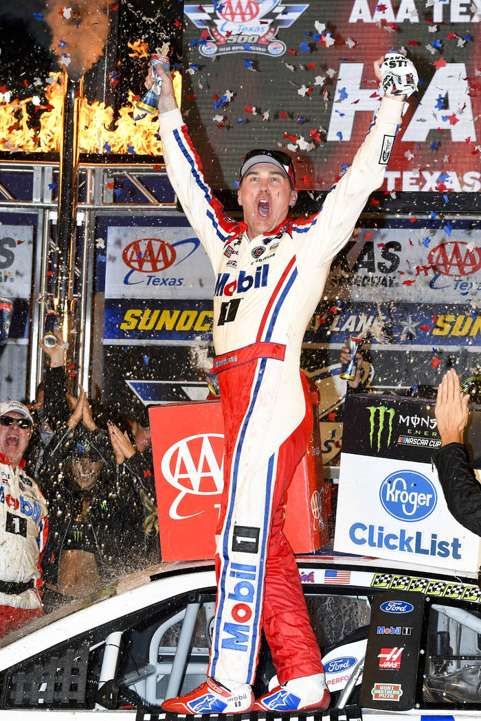 Kevin Harvick celebrates after winning a NASCAR Cup auto race in Victory Lane at Texas Motor Speedway, Sunday, Nov. 4, 2018, in Fort Worth, Texas. (AP Photo/Larry Papke)