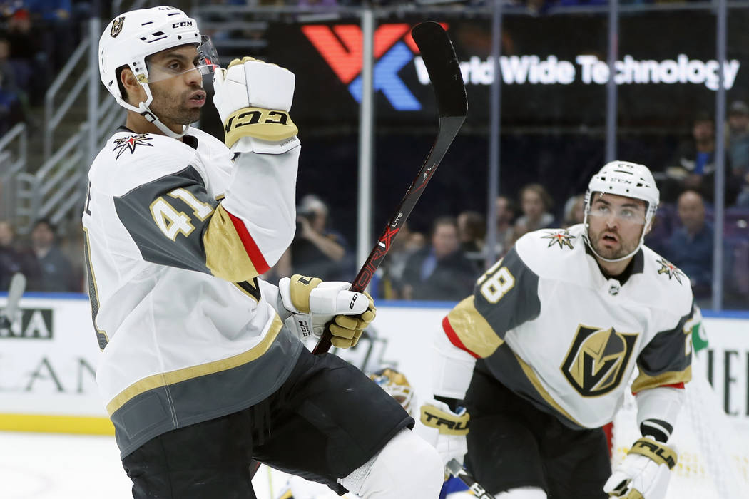 Vegas Golden Knights' Pierre-Edouard Bellemare (41), of France, celebrates after scoring as teammate William Carrier (28) watches during the first period of an NHL hockey game against the St. Loui ...