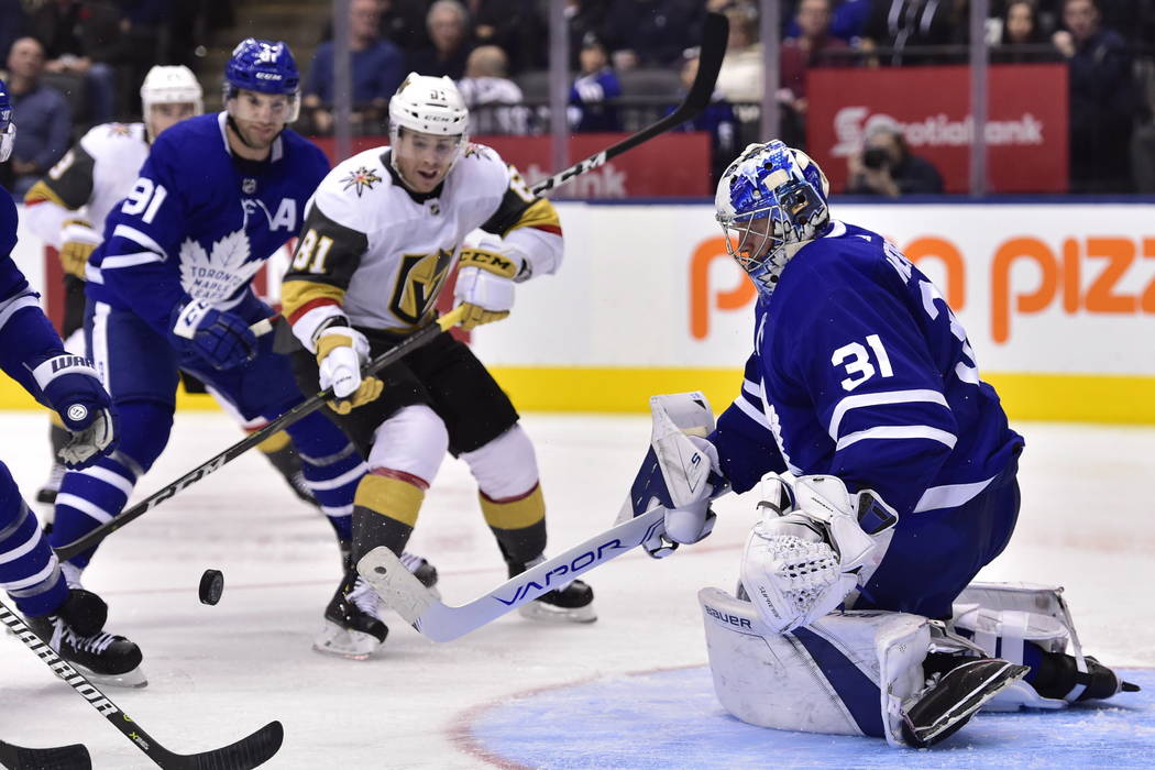 Toronto Maple Leafs goaltender Frederik Andersen (31) watches the puck as Vegas Golden Knights center Jonathan Marchessault (81) looks for a rebound during the third period of an NHL hockey game T ...