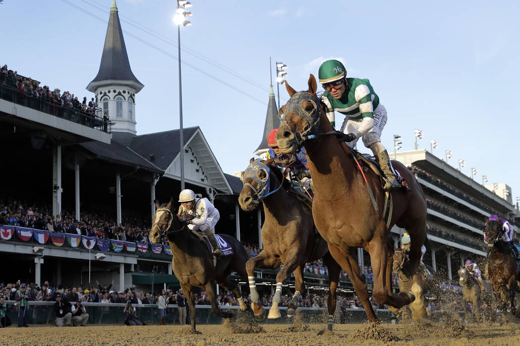 Joel Rosario rides Accelerate to victory in the Breeders' Cup Classic horse race at Churchill Downs, Saturday, Nov. 3, 2018, in Louisville, Ky. (AP Photo/Darron Cummings)