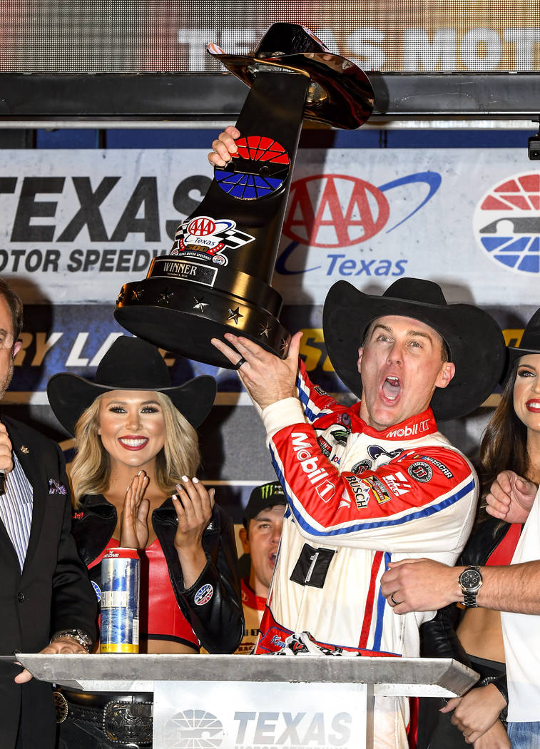 Kevin Harvick celebrates in Victory Lane after winning a NASCAR Cup auto race at Texas Motor Speedway, Sunday, Nov. 4, 2018, in Fort Worth, Texas. (AP Photo/Larry Papke)