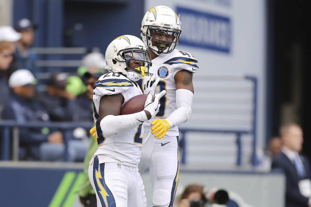 Los Angeles Chargers defensive back Desmond King (20) and Los Angeles Chargers cornerback Michael Davis (43) celebrate after a pick six by King in the second half of an NFL football game, Sunday, ...