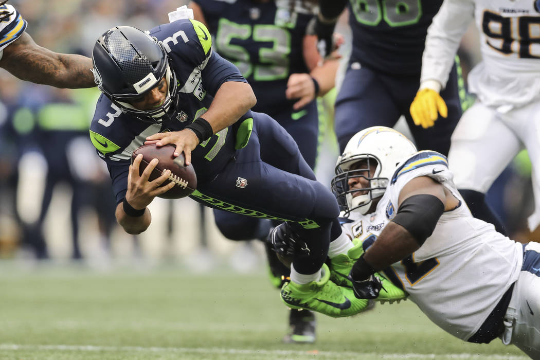 Seattle Seahawks quarterback Russell Wilson (3) dives for extra yardage in the second half of an NFL football game, Sunday, Oct. 28, 2018, in Los Angeles. (AP Photo/Peter Joneleit)