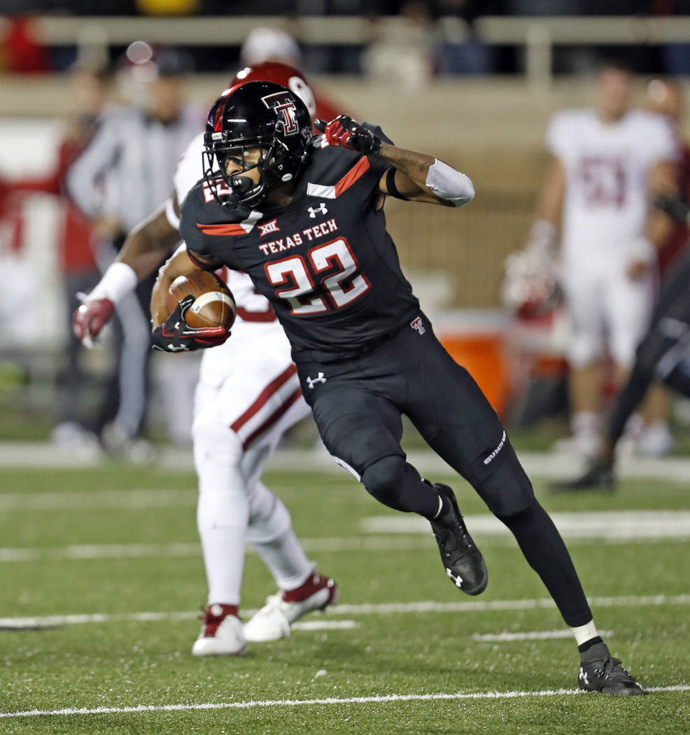 Texas Tech's Seth Collins (22) runs down field with the ball during the first half of an NCAA college football game against Oklahoma, Saturday, Nov. 3, 2018, in Lubbock, Texas. (AP Photo/Brad Toll ...
