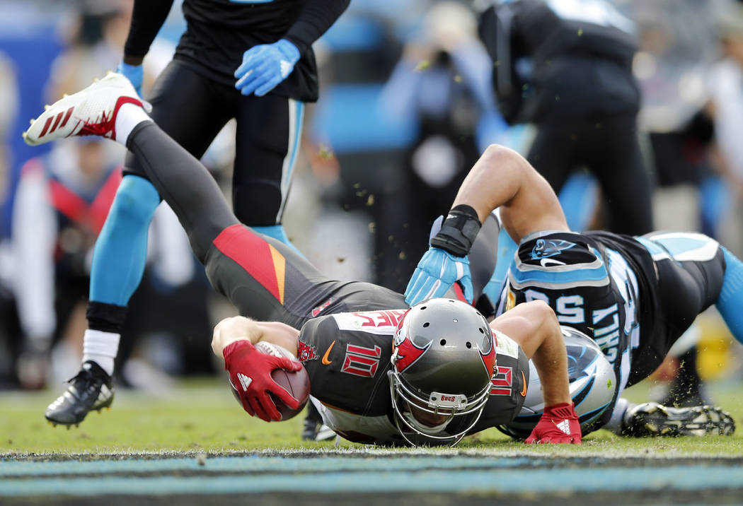 Tampa Bay Buccaneers' Adam Humphries (10) dives for a touchdown against Carolina Panthers' Luke Kuechly (59) in the second half of an NFL football game in Charlotte, N.C., Sunday, Nov. 4, 2018. (A ...