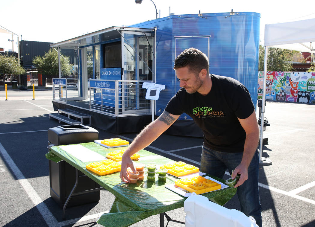 Patrick Haggerty, co-founder of Greens and Proteins, displays protein drinks outside the Chase for Business BizMobile, a 27-foot advice center on wheels, on Thursday, Nov. 8, 2018, in Las Vegas. B ...