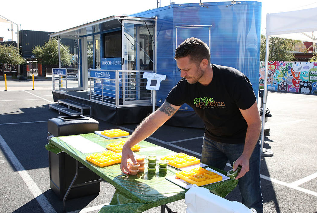 Patrick Haggerty, co-founder of Greens and Proteins, displays protein drinks outside the Chase for Business BizMobile, a 27-foot advice center on wheels, on Thursday, Nov. 8, 2018, in Las Vegas. B ...
