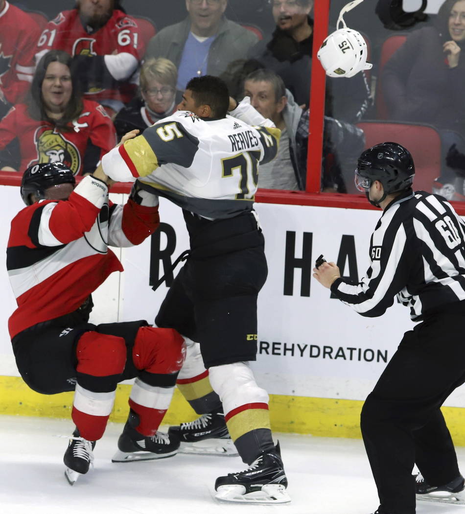 Ottawa Senators defenseman Mark Borowiecki (74) and Vegas Golden Knights right wing Ryan Reaves (75) fight during the second period of an NHL hockey game, Wednesday, Nov. 8, 2018 in Ottawa, Ontari ...