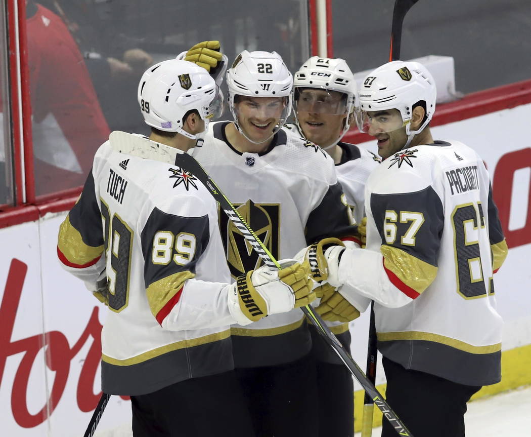 Vegas Golden Knights defenseman Nick Holden (22) celebrates his goal against the Ottawa Senators with teammates left wing Max Pacioretty (67) right wing Alex Tuch (89) and center Cody Eakin (21) d ...