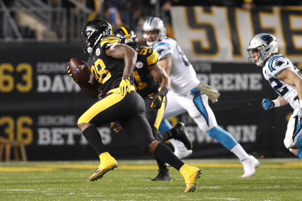 Pittsburgh Steelers inside linebacker Vince Williams (98) returns an interception for a touchdown during the first half of the team's NFL football game against the Carolina Panthers in Pittsburgh, ...