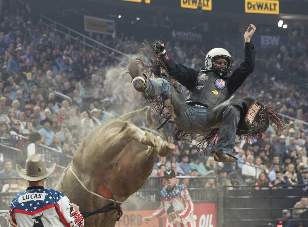 Michael Lane gets thrown off of "Heartbreak Kid" during the Professional Bull Riders World Finals on Thursday, November 8, 2018, at T-Mobile Arena, in Las Vegas. Benjamin Hager Las Vegas ...
