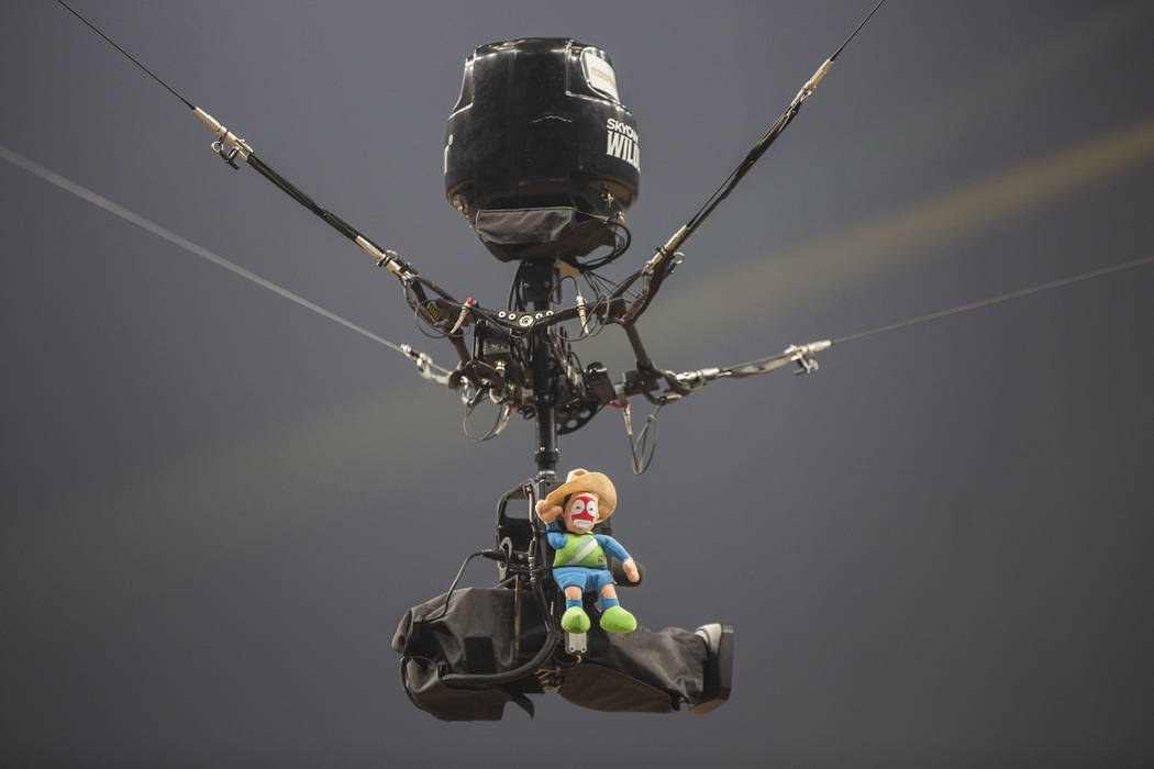 A toy rodeo clown rides the sky cam during the Professional Bull Riders World Finals on Thursday, November 8, 2018, at T-Mobile Arena, in Las Vegas. Benjamin Hager Las Vegas Review-Journal