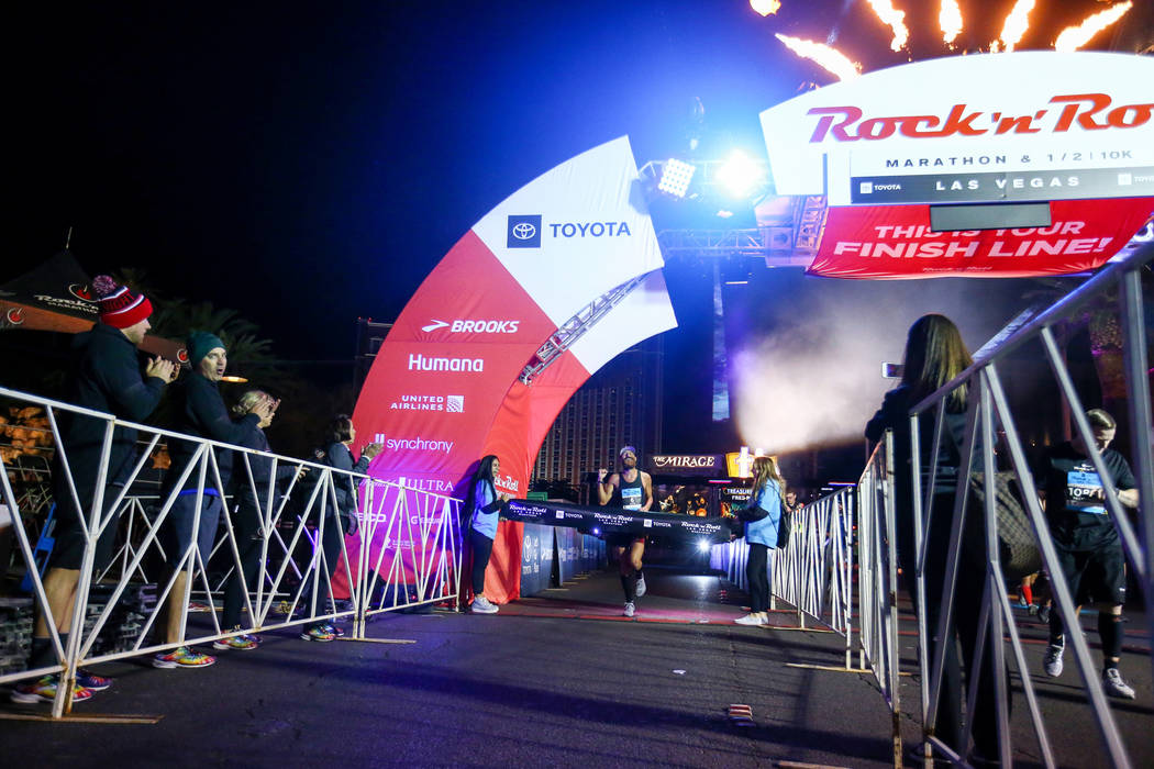 First place finisher Thomas Puzey crosses the finish line during the 2018 Rock 'n' Roll Marathon on the Strip in Las Vegas, Sunday,Nov. 11, 2018. Caroline Brehman/Las Vegas Review-Journal