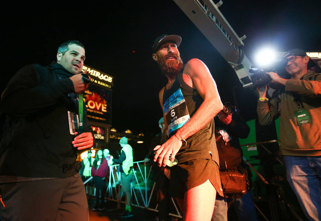 First place finisher Thomas Puzey looks back moments after crossing the finish line during the 2018 Rock 'n' Roll Marathon on the Strip in Las Vegas, Sunday,Nov. 11, 2018. Caroline Brehman/Las Veg ...