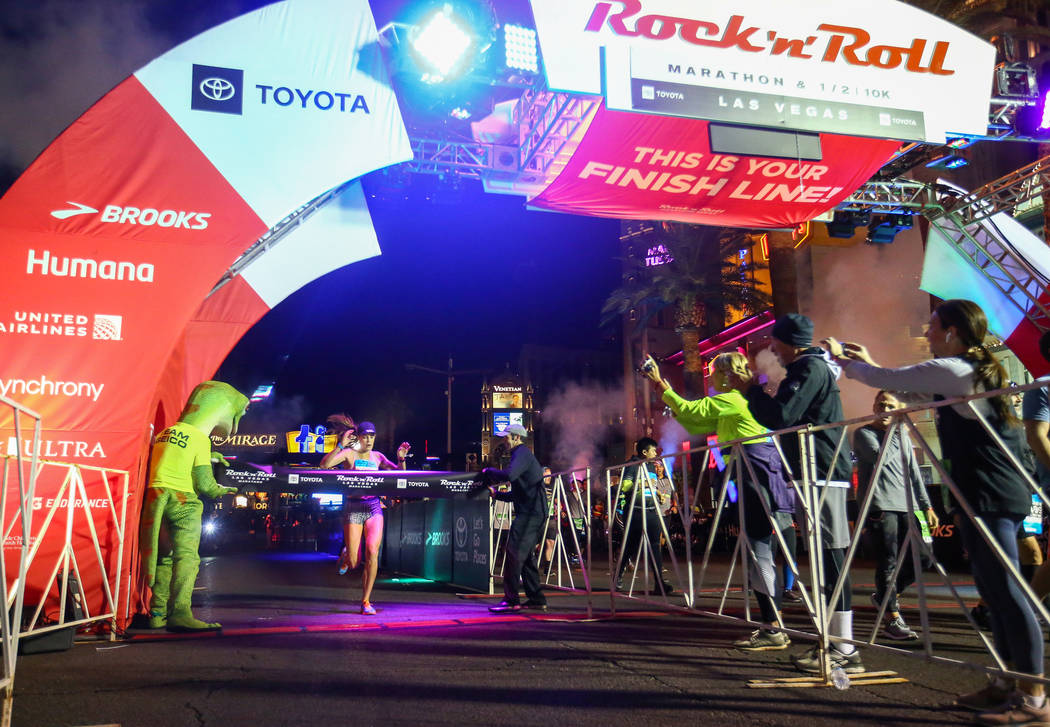 First place women's finisher Hannah McInturff crosses the finish line during the 2018 Rock 'n' Roll Marathon on the Strip in Las Vegas, Sunday,Nov. 11, 2018. Caroline Brehman/Las Vegas Review-Journal