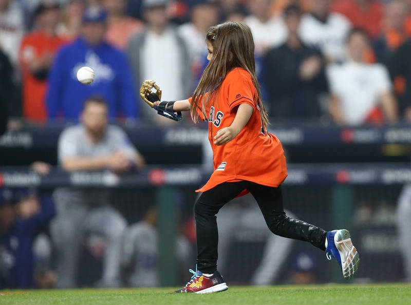 Oct 28, 2017; Houston, TX, USA; Hailey Dawson throws out the ceremonial first pitch before game four of the 2017 World Series between the Houston Astros and the Los Angeles Dodgers at Minute Maid ...