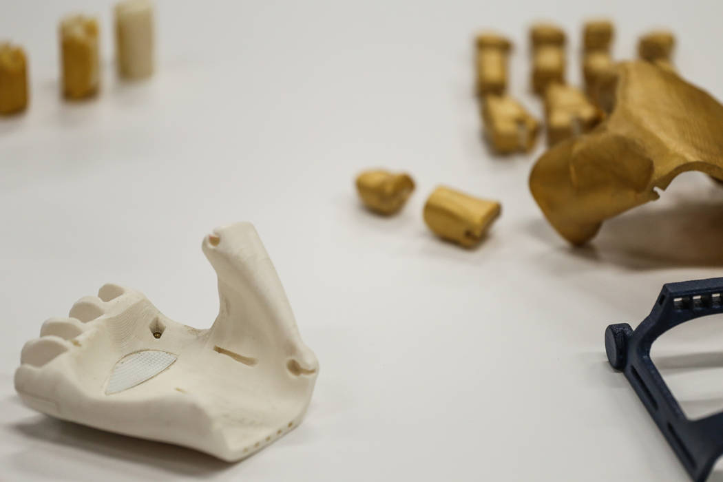 Parts for a 3-D printed prosthetic hand are laid out on a table during a painting process at the Thomas T. Beam Engineering Complex at UNLV in Las Vegas, Saturday, Oct. 14, 2017. A team of student ...