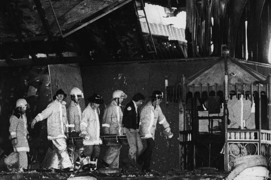 Clark County Firefighter remove a body from the entrance of the MGM Grand following the November 21, 1980 MGM Grand Hotel fire. Over 200 firefighters responded to the blaze. Initial responders arr ...