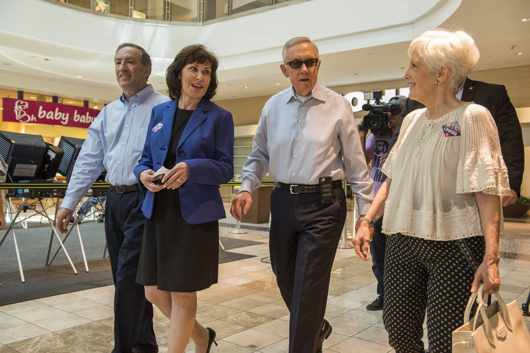 Jacky Rosen and U.S. Senator Harry Reid are seen walking with their spouses Larry, left, and Landra, right after voting at the Galleria Mall at Sunset in Henderson, Nev., on Thursday, June 2, 2016 ...