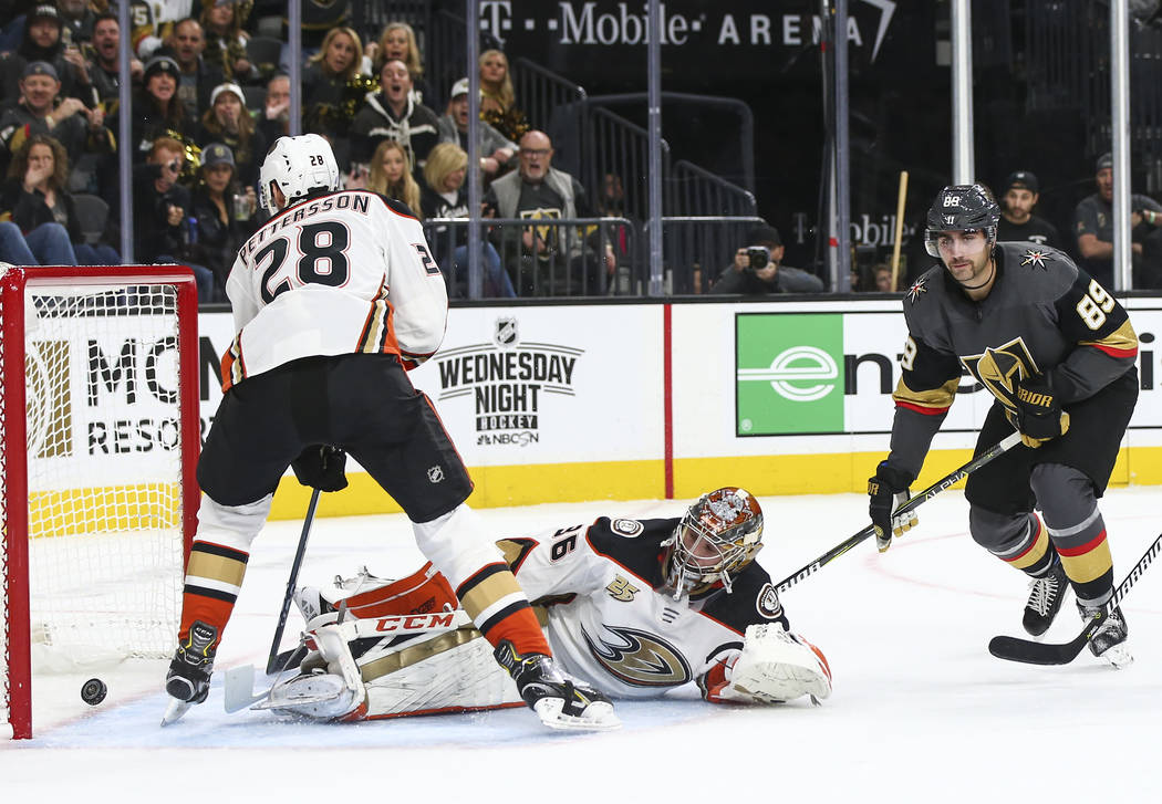Golden Knights right wing Alex Tuch (89) gets the puck past Anaheim Ducks goaltender John Gibson (36) to score a goal during the first period of an NHL hockey game at T-Mobile Arena in Las Vegas o ...